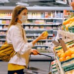 Person shopping in produce section of local store