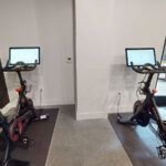Allston Place fitness center Peloton stationary bikes with personal screens