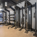 Fitness center with natural light and strength training equipment
