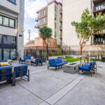 Outdoor lounge seating, firepits, cornhole, grills in community courtyard